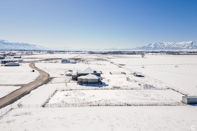 snowy aerial view with a mountain view