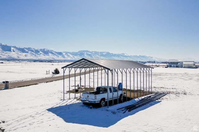 exterior space featuring a mountain view and a carport