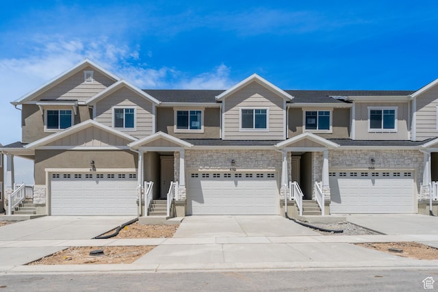 672 W 4500 S Unit 317, Mapleton, UT 84664 - multi unit property featuring an attached garage, board and batten siding, stone siding, and concrete driveway