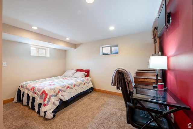bedroom featuring multiple windows, baseboards, and carpet floors