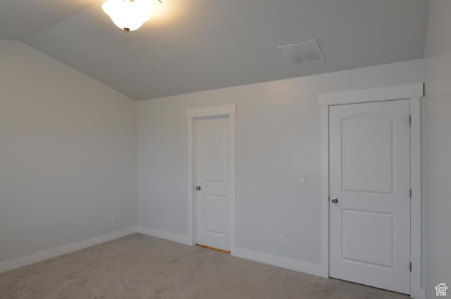 5289 W Van Dyne Ln, Herriman, UT 84096 - empty room featuring visible vents, light colored carpet, baseboards, and vaulted ceiling