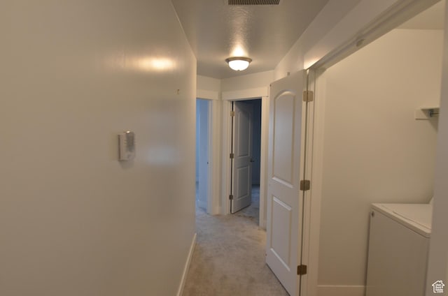 5289 W Van Dyne Ln, Herriman, UT 84096 - hall with visible vents, baseboards, light colored carpet, and washer / dryer
