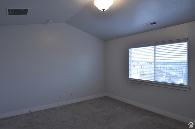 5289 W Van Dyne Ln, Herriman, UT 84096 - empty room with visible vents, lofted ceiling, baseboards, and carpet floors