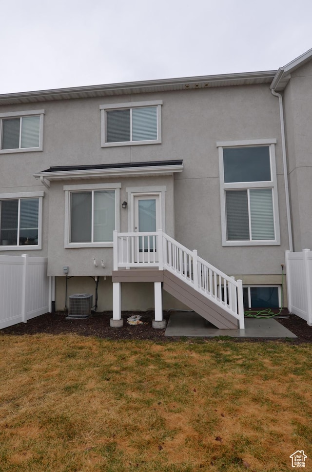 5289 W Van Dyne Ln, Herriman, UT 84096 - back of house with stucco siding, a yard, and fence