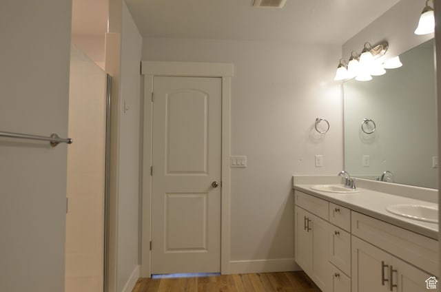 5289 W Van Dyne Ln, Herriman, UT 84096 - full bath with double vanity, wood finished floors, baseboards, and a sink