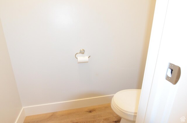 5289 W Van Dyne Ln, Herriman, UT 84096 - bathroom featuring baseboards, toilet, and wood finished floors