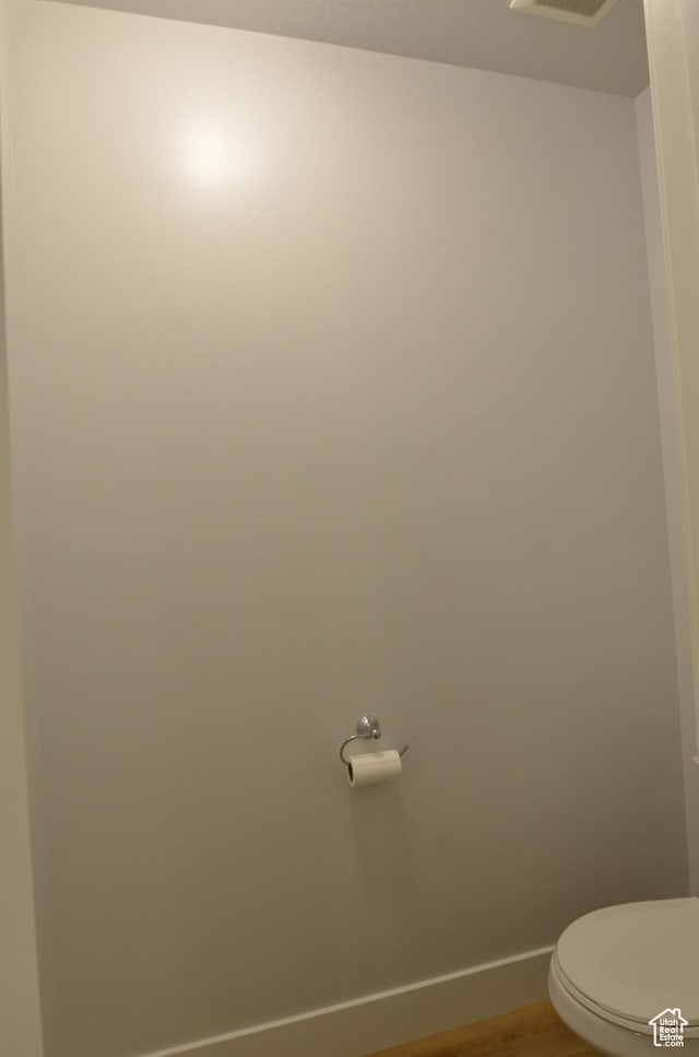 5289 W Van Dyne Ln, Herriman, UT 84096 - bathroom with toilet, baseboards, and wood finished floors