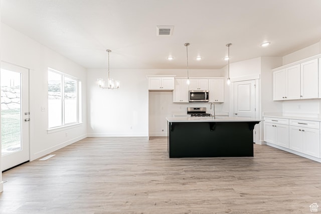 642 W 4500 S Unit 322, Mapleton, UT 84664 - kitchen featuring stainless steel appliances, light wood-type flooring, a chandelier, white cabinetry, and recessed lighting