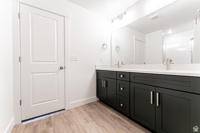 642 W 4500 S Unit 322, Mapleton, UT 84664 - bathroom with double vanity and wood finished floors