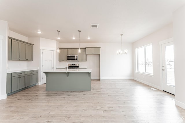 624 W 4500 S Unit 325, Mapleton, UT 84664 - kitchen featuring appliances with stainless steel finishes, gray cabinetry, a chandelier, light wood-style flooring, and recessed lighting