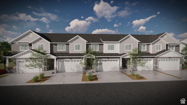 multi unit property with driveway, stone siding, board and batten siding, an attached garage, and a shingled roof