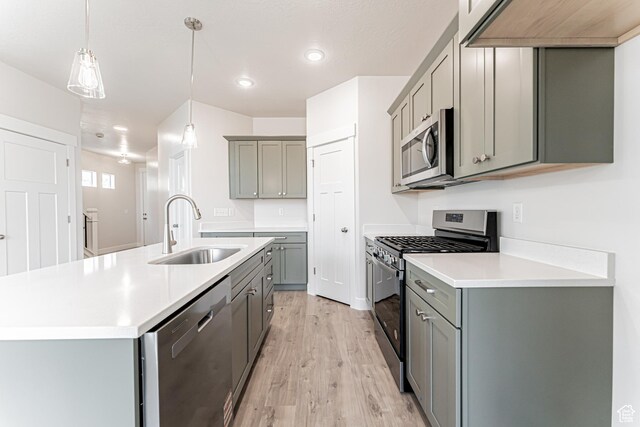 624 W 4500 S Unit 325, Mapleton, UT 84664 - kitchen with appliances with stainless steel finishes, gray cabinets, light wood finished floors, light countertops, and recessed lighting