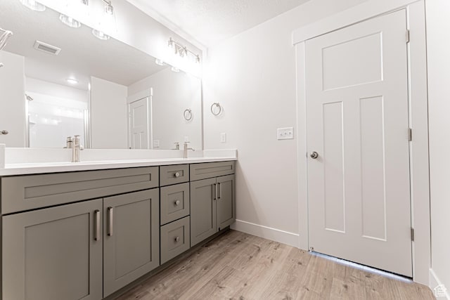 624 W 4500 S Unit 325, Mapleton, UT 84664 - full bathroom featuring double vanity and wood finished floors