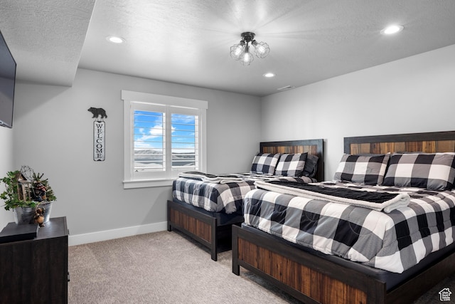 3278 S Serviceberry Dr Unit 18, Garden City, UT 84028 - bedroom featuring light carpet, recessed lighting, baseboards, and a textured ceiling