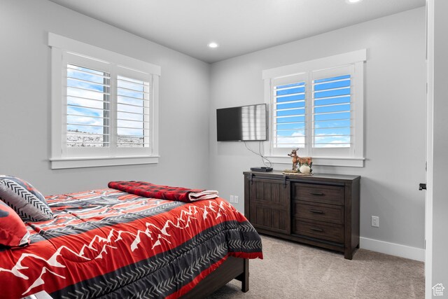 3278 S Serviceberry Dr Unit 18, Garden City, UT 84028 - bedroom featuring multiple windows, light colored carpet, recessed lighting, and baseboards