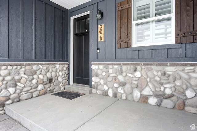 3278 S Serviceberry Dr Unit 18, Garden City, UT 84028 - doorway to property featuring board and batten siding