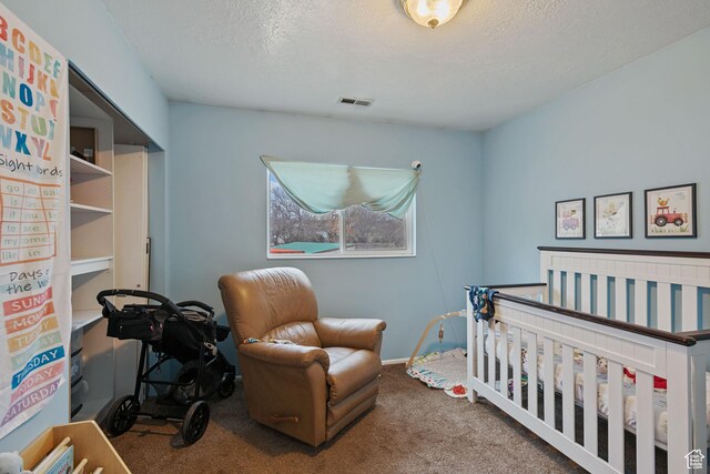 4443 S 1025 W, Riverdale, UT 84405 - carpeted bedroom featuring visible vents, a textured ceiling, and a nursery area
