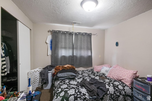 4443 S 1025 W, Riverdale, UT 84405 - bedroom with carpet flooring, visible vents, a closet, and a textured ceiling