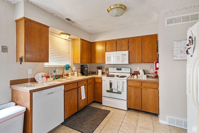 4443 S 1025 W, Riverdale, UT 84405 - kitchen featuring white appliances, light countertops, visible vents, and a sink