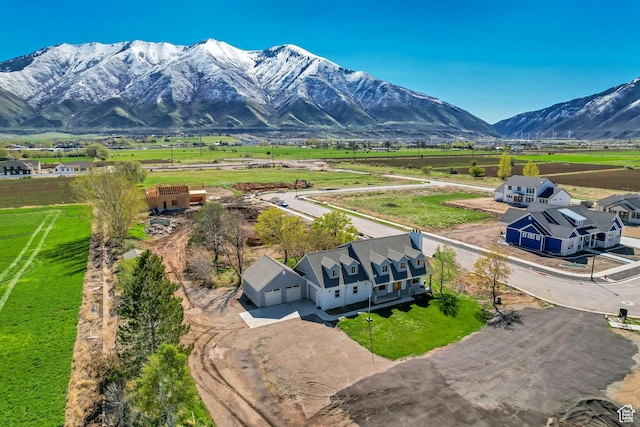 drone / aerial view featuring a rural view and a mountain view