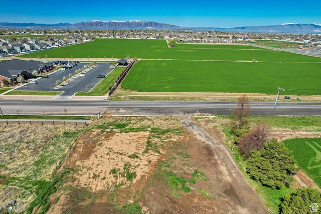 birds eye view of property featuring a mountain view and a residential view