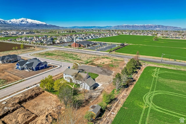 birds eye view of property with a mountain view and a residential view