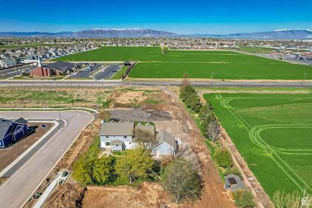 birds eye view of property with a mountain view and a residential view