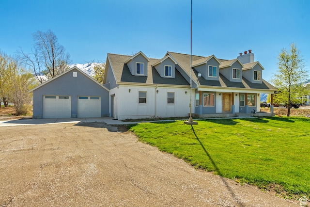cape cod house featuring a chimney, covered porch, an outbuilding, driveway, and a front yard
