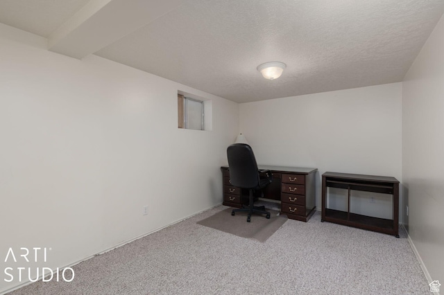 office area with carpet flooring and a textured ceiling