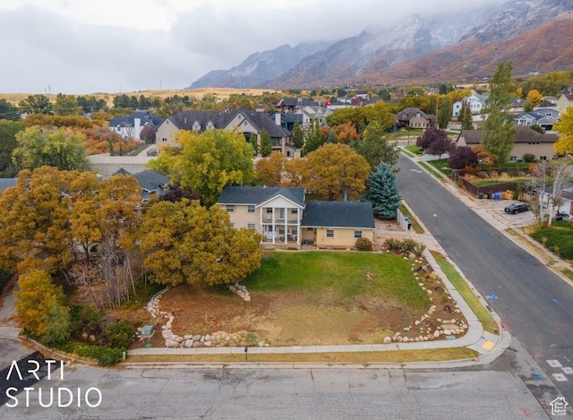aerial view featuring a mountain view and a residential view