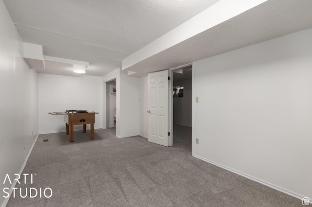 finished basement with baseboards and carpet
