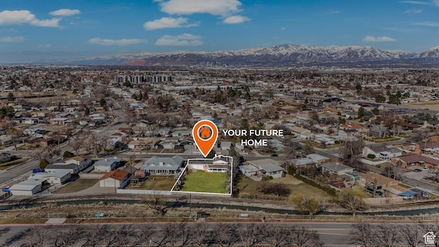 aerial view featuring a mountain view and a residential view