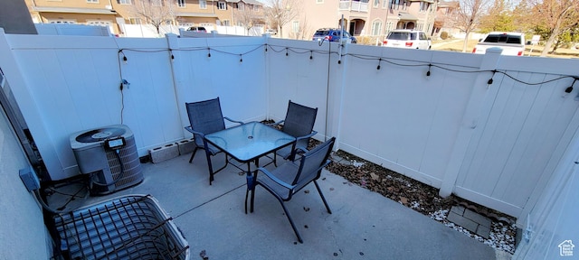 view of patio with a residential view and fence