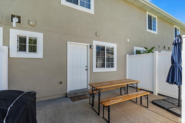 1322 E 6175 S, South Ogden, UT 84405 - back of property with a patio area, stucco siding, outdoor dining area, and fence