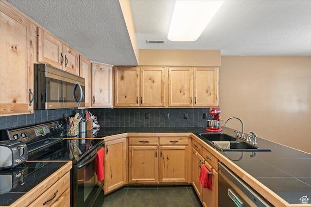 1322 E 6175 S, South Ogden, UT 84405 - kitchen with light brown cabinets, dark tile patterned floors, tile countertops, appliances with stainless steel finishes, and a sink