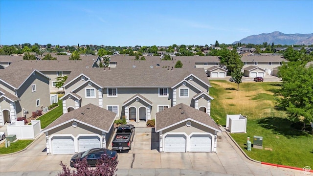 1322 E 6175 S, South Ogden, UT 84405 - view of front of house featuring stucco siding, driveway, a mountain view, a residential view, and an attached garage