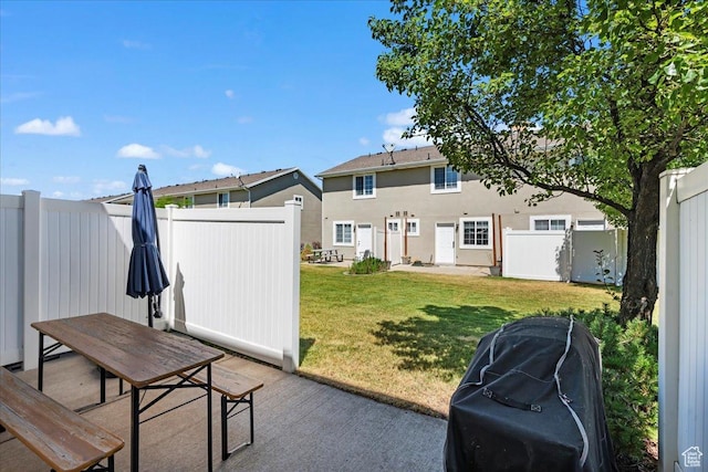1322 E 6175 S, South Ogden, UT 84405 - rear view of property with stucco siding, a lawn, a fenced backyard, outdoor dining area, and a patio area