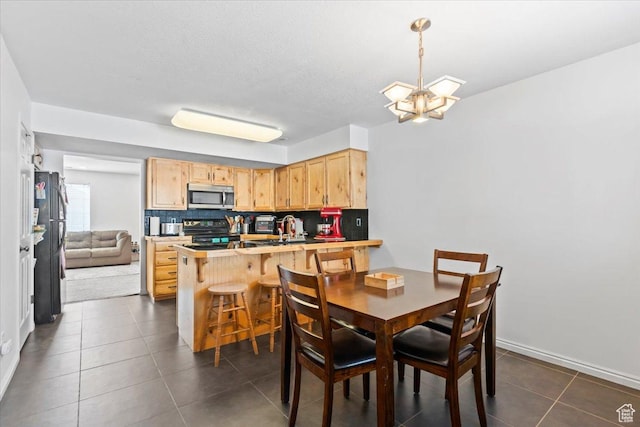 1322 E 6175 S, South Ogden, UT 84405 - dining space featuring a chandelier and dark tile patterned floors