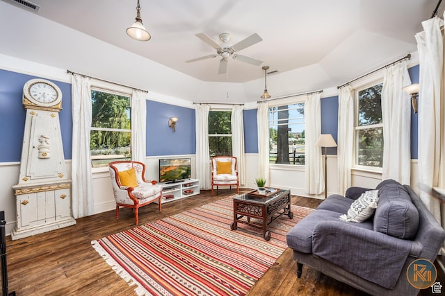 197 N 200 W, Kanab, UT 84741 - sitting room with ceiling fan, a raised ceiling, wood finished floors, and wainscoting