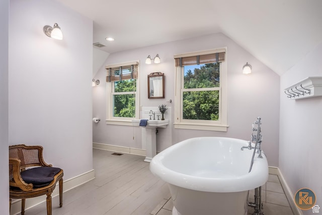 197 N 200 W, Kanab, UT 84741 - full bathroom featuring baseboards, lofted ceiling, recessed lighting, wood finished floors, and a soaking tub