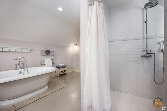 197 N 200 W, Kanab, UT 84741 - full bathroom with baseboards, a freestanding bath, lofted ceiling, a tile shower, and wood finished floors