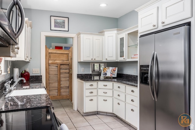 197 N 200 W, Kanab, UT 84741 - kitchen with light tile patterned floors, electric range, stainless steel fridge, white cabinetry, and a sink