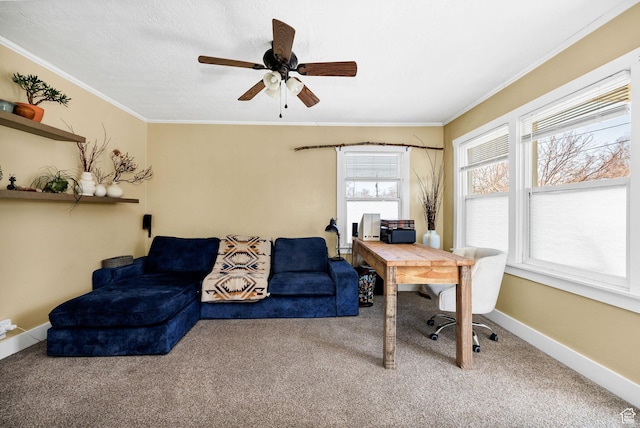 carpeted office with baseboards, ceiling fan, and crown molding