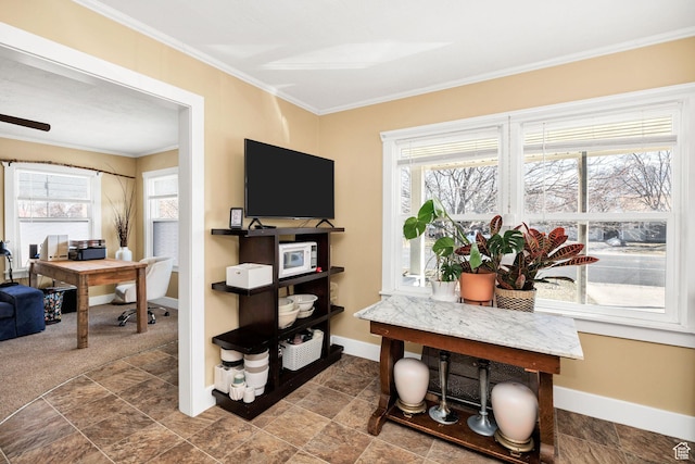 home office with stone finish flooring, baseboards, and crown molding