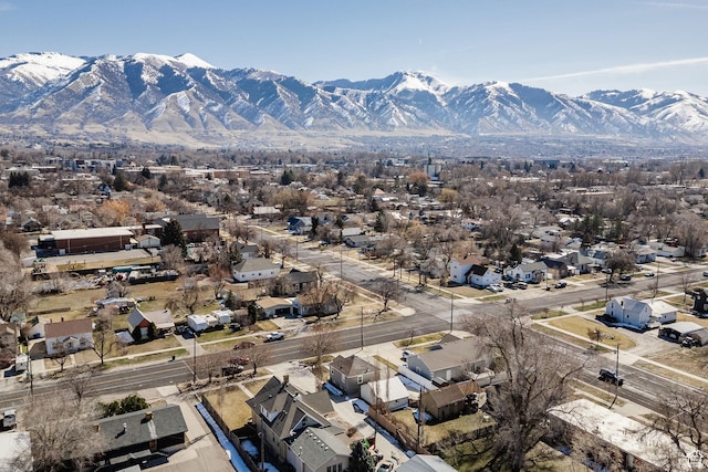 drone / aerial view featuring a residential view and a mountain view