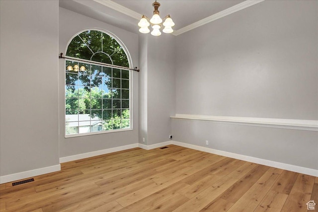 5772 Oakwood Dr, South Ogden, UT 84405 - empty room featuring a chandelier, hardwood / wood-style flooring, and ornamental molding