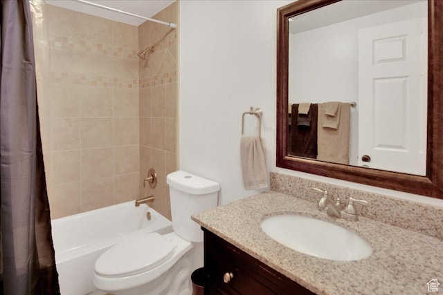 bathroom featuring shower / bath combination with curtain, toilet, and vanity