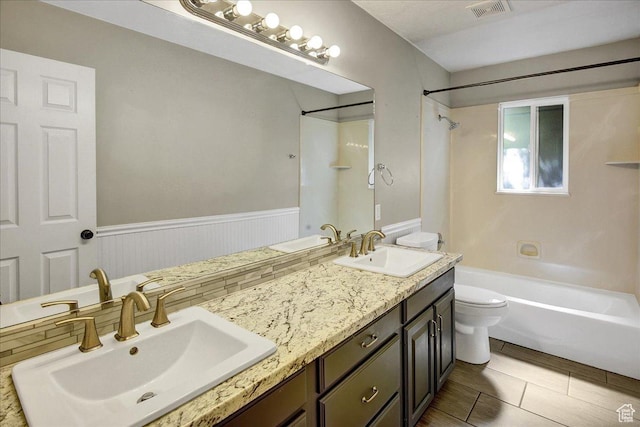 5772 Oakwood Dr, South Ogden, UT 84405 - full bathroom with double vanity, tub / shower combination, and wainscoting