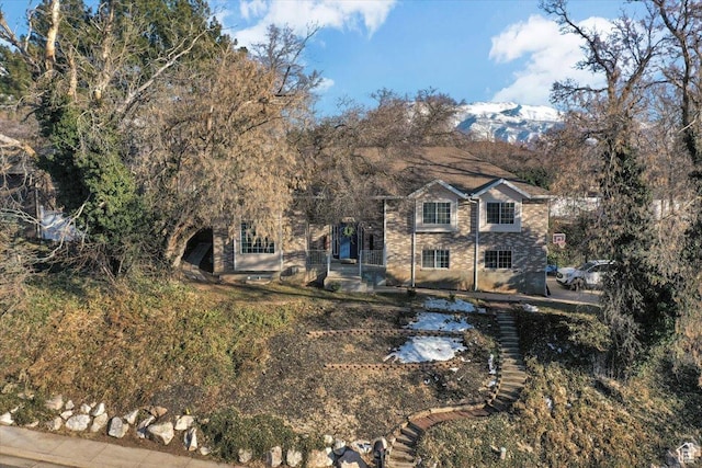 view of front of home with stone siding