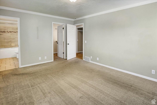 5772 Oakwood Dr, South Ogden, UT 84405 - unfurnished bedroom with carpet flooring, a spacious closet, ornamental molding, connected bathroom, and a closet